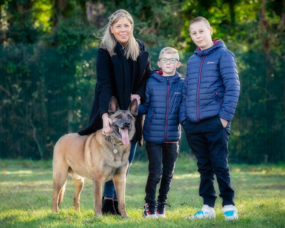 Retired police dog Tai with his family